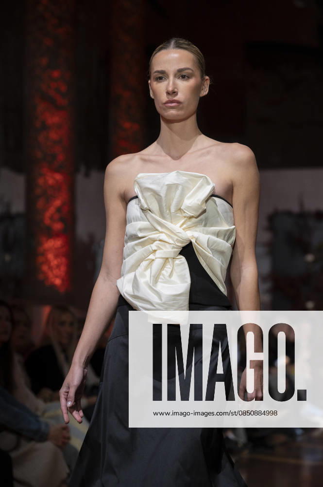 Telier Couture Fashion Week Madrid in Spain - 17 Mar 2026 A model walks the runway wearing a design by atelier couture during Fashion Week de Madrid in Fabric de Tapices. Madrid Spain