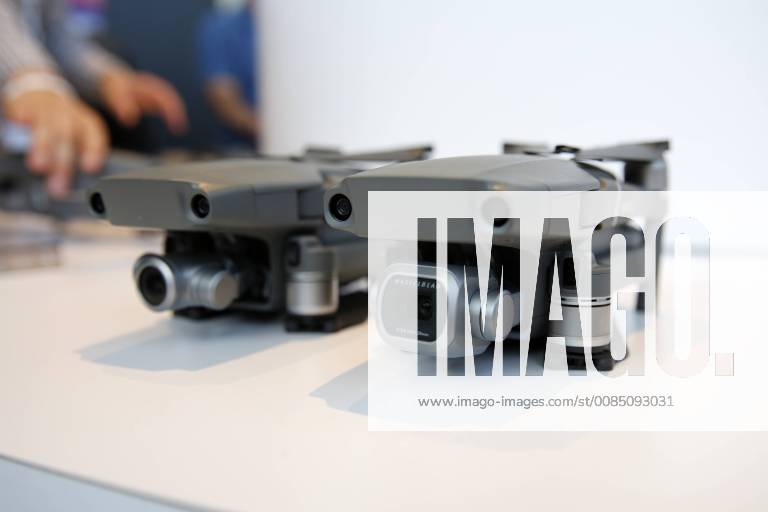 (180823) -- NEW YORK, Aug. 23, 2018 -- Photo taken on Aug. 23, 2018 shows the newly-released DJI Mavic 2 Pro (R) and Mavic 2 Zoom drones during the launching ceremony in New York, the United States. Chinese drone manufacturer DJI released its new Mavic drone lineup, the Mavic 2 Pro and Mavic 2 Zoom, in New York on Thursday. Mavic 2 Pro has an integrated Hasselblad camera, and Mavic 2 Zoom is a foldable consumer drone with optical zoom capability. ) U.S.-NEW YORK-DJI-DRONE-RELEASE LixMuzi