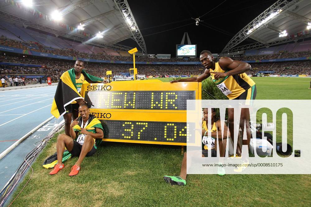 DAEGU, Sept. 4, 2011 -- (L-R) Jamaica s Nesta Carter, Michael Frater, Yohan Blake and Usain Bolt pose by the stop clock with their new world record time of 37.04 after winning the men s 4x100 metres relay final at the IAAF World Athletics Championships in Daegu, South Korea