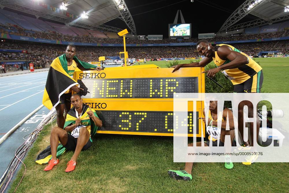 DAEGU, Sept. 4, 2011 -- (L-R) Jamaica s Nesta Carter, Michael Frater, Yohan Blake and Usain Bolt pose by the stop clock with their new world record time of 37.04 after winning the men s 4x100 metres relay final at the IAAF World Athletics Championships in Daegu, South Korea