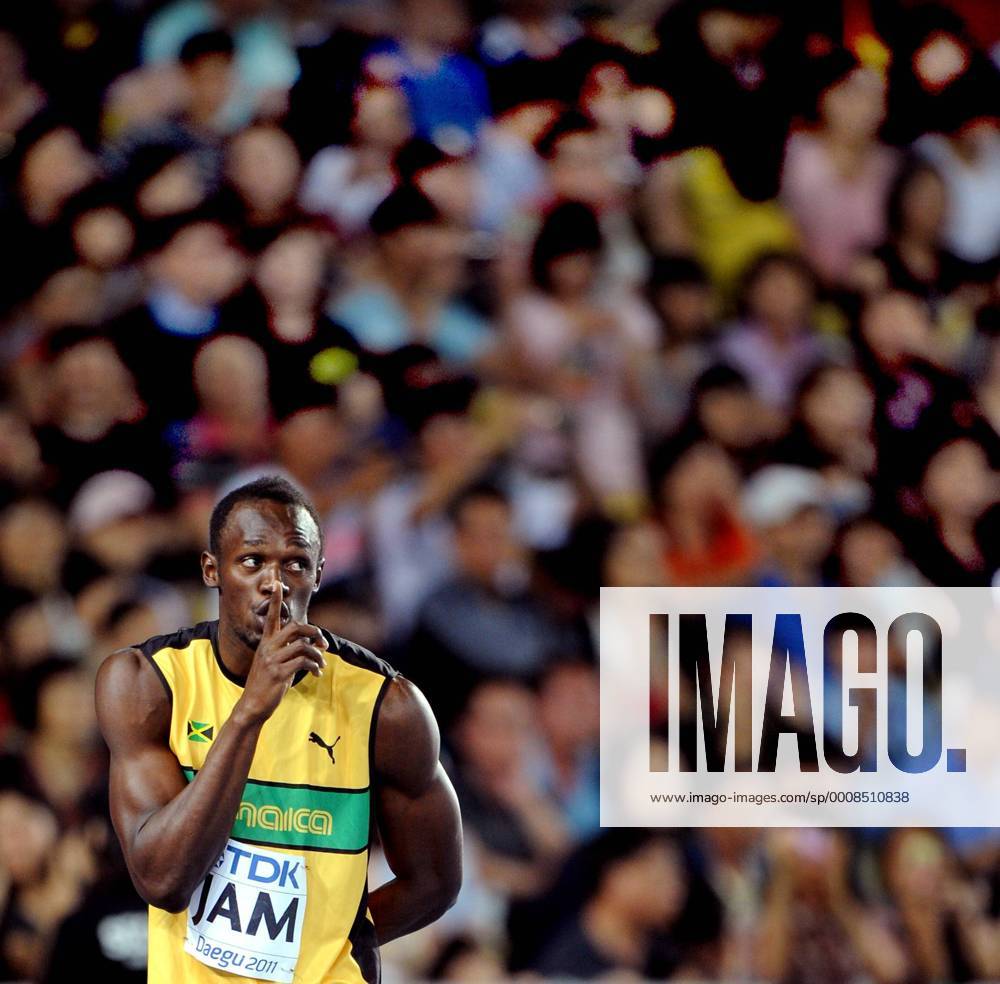 DAEGU, Sept. 4, 2011 -- Usain Bolt of Jamaica makes a shush gesture before taking the baton from teammate in the men s 4x100 metres relay final at the IAAF World Athletics Championships in Daegu, September 4, 2011. Jamaica won the gold of the event in 37.04 seconds and set a new world record. (Xinhua Chen Xiaowei)