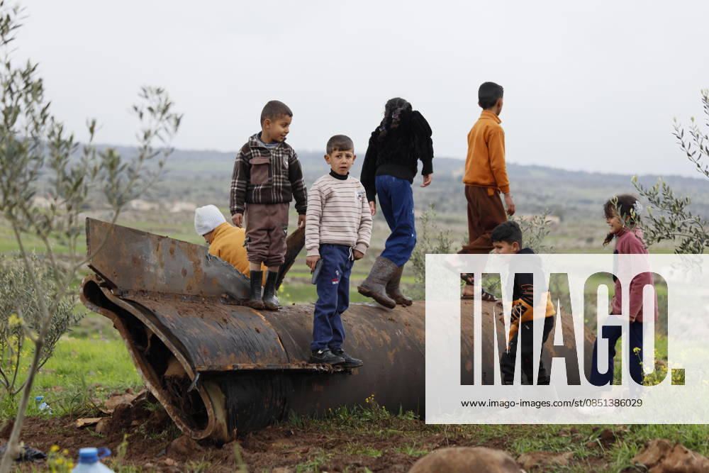 An Iranian missile landed in the Quneitra province in southern Syria QUNEITRA, SYRIA - MARCH 22: Children are seen on the wreckage of an Iranian missile that fell near the village of Zubeyda village after being destroyed by air defense systems in the Quneitra province of southern Syria on March 22, 2026. No casualties or injuries were reported as a result of the rocket landing in an empty field. Enver Asfur Anadolu Quneitra Syria. Editorial use only. Please get in touch for any other usage.