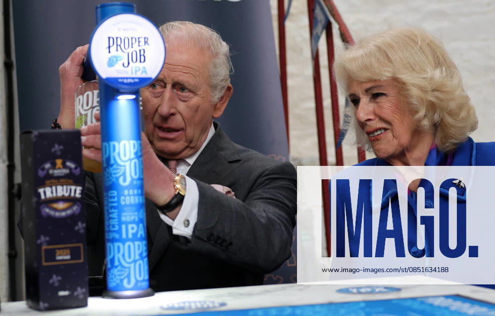 King Charles and Queen Camilla visit Cornwall, UK, 24 March 2026 Britain s Queen Camilla reacts as King Charles III pulls a pint of St Austell Brewery s Proper Job IPA 0.5%, during a visit to the The Market Hall in St Austell, south-west England on March 24, 2026., Credit:ADRIAN DENNIS Avalon United Kingdom, Cornwall