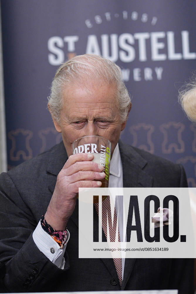 King Charles and Queen Camilla visit Cornwall, UK, 24 March 2026 King Charles III tries a pint of beer during a walkabout in The Market Hall, Saint Austell, Cornwall. Picture date: Tuesday March 24, 2026., Credit:Aaron Chown Avalon United Kingdom, Cornwall