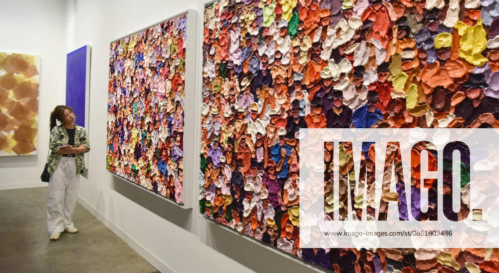 (260326) -- HONG KONG, March 26, 2026 -- A visitor views exhibits at the preview of Art Basel Hong Kong 2026 at the Hong Kong Convention and Exhibition Center in south China s Hong Kong, March 25, 2026. Art Basel Hong Kong 2026 held its preview here on Wednesday, bringing together 240 galleries from 41 countries and regions. Featuring six themed sectors and programs, the fair will open to the public from Friday to Sunday. ) CHINA-HONG KONG-ART BASEL-PREVIEW (CN) ChenxDuo