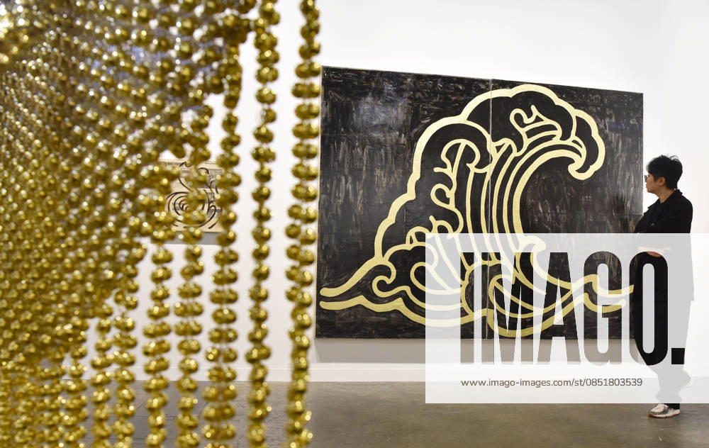 (260326) -- HONG KONG, March 26, 2026 -- A visitor views exhibits at the preview of Art Basel Hong Kong 2026 at the Hong Kong Convention and Exhibition Center in south China s Hong Kong, March 25, 2026. Art Basel Hong Kong 2026 held its preview here on Wednesday, bringing together 240 galleries from 41 countries and regions. Featuring six themed sectors and programs, the fair will open to the public from Friday to Sunday. ) CHINA-HONG KONG-ART BASEL-PREVIEW (CN) ChenxDuo
