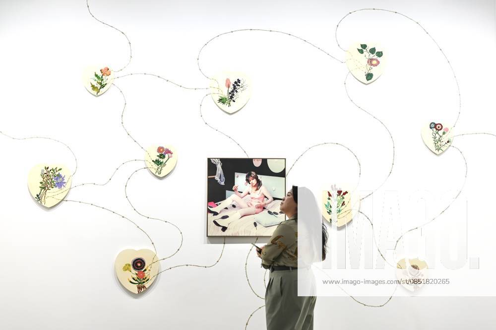 A woman views an artwork at the preview of Art Basel Hong Kong 2026 at the Hong Kong Convention and Exhibition Center on March 25, 2026 in Hong Kong, China. Art Basel Hong Kong 2026 held its preview on March 25 at the Hong Kong Convention and Exhibition Center, bringing together 240 galleries from 41 countries and regions.