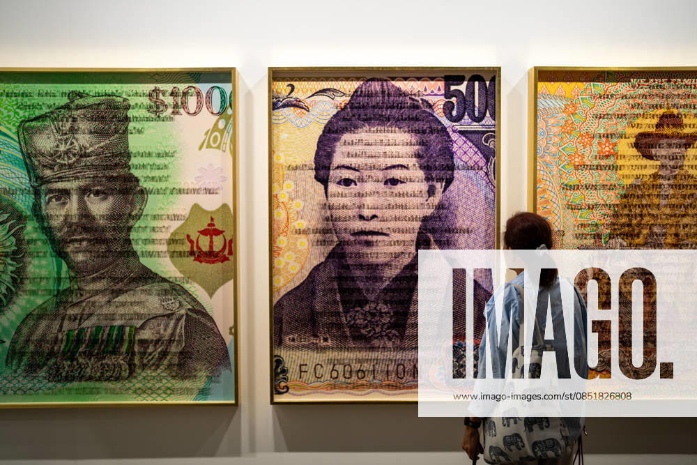 HONGKONG-ART ART-BASEL A woman looking at art displays handing on the wall at Art Basel 2026 in Hong Kong, March 26, 2026. NEXPHER Vernon Yuen HONG KONG