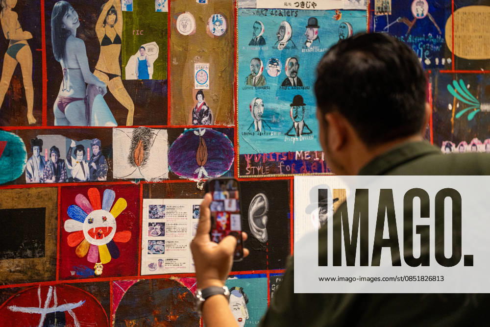 HONGKONG-ART ART-BASEL A man taking a photo of an art display at Art Basel 2026 in Hong Kong, March 26, 2026. NEXPHER Vernon Yuen HONG KONG
