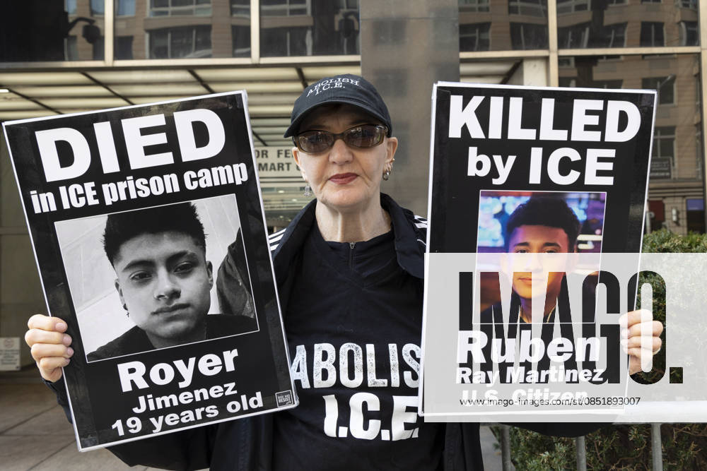 A person wears a shirt that reads ABOLISH I.C.E. and holds signs that read DIED in ICE prison camp Royer Jiminez 19 years old KILLED by ICE Ruben Ray Martinez U.S. Citizen with their pictures outside 26 Federal Plaza in Manhattan s Civic Center joining peaceful demonstrators memorializing those who have died from Immigration and Customs Enforcement (I.C.E.) violence and denouncing the Trump administration s deportation policy. The protest takes place as the Department of Homeland Security (D.H.S.) remains shutdown with Democrats in Congress demanding restrictions on federal immigration officers before approving funding for the agency. New York USA - ZUMAr174 20260326_znp_r174_004