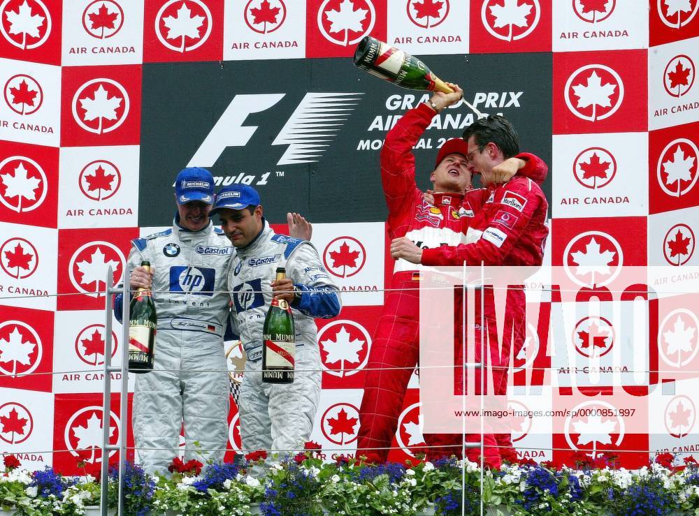 Siegerehrung beim Großen Preis von Kanada 2003, v.li.: Ralf Schumacher (Deutschland), Juan Pablo Montoya (Kolumbien beide BMW-Williams), Michael Schumacher (Deutschland) und Renningenieur Chris Dyer (Australien beide Ferrari) Motorsport Grand Prix Herren Großer Preis von Kanada 2003, Formel 1 Weltmeisterschaft, F1, F, GP, WM, Vdig Gruppe Montreal Freude,