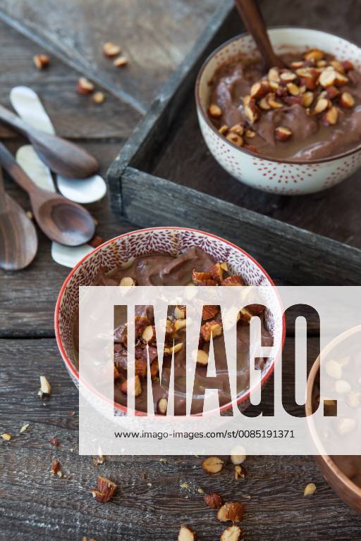 Delicious chocolate pudding with almonds and caramel sauce Chocolate pudding with roasted almonds 1079705185