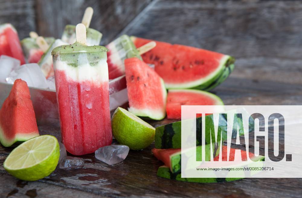 Popsicles with yogurt and fresh fruits Homemade frozen popsicles 1079705161