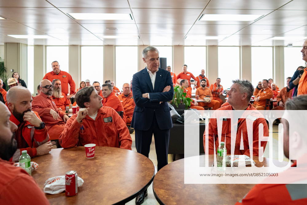 Prime Minister Mark Carney meets with steelworkers inside the cafeteria of an ArcelorMittal Dofasco facility in Hamilton, Ont., on Sunday, March 29, 2026. Hamilton Canada - ZUMAc35_ 20260329_zaf_c35_121