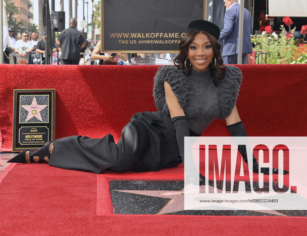 Singer, songwriter and actress Brandy sits next to her star during an unveiling ceremony honoring her with the 2,839th star on the Hollywood Walk of Fame in Los Angeles on Monday, March 30, 2026. LAP2026033009 JIMxRUYMEN
