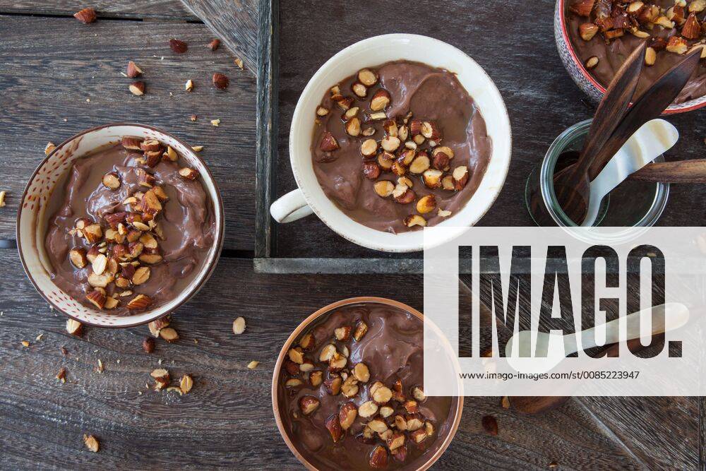 Delicious chocolate pudding with almonds and caramel sauce Chocolate pudding with roasted almonds 1079705184