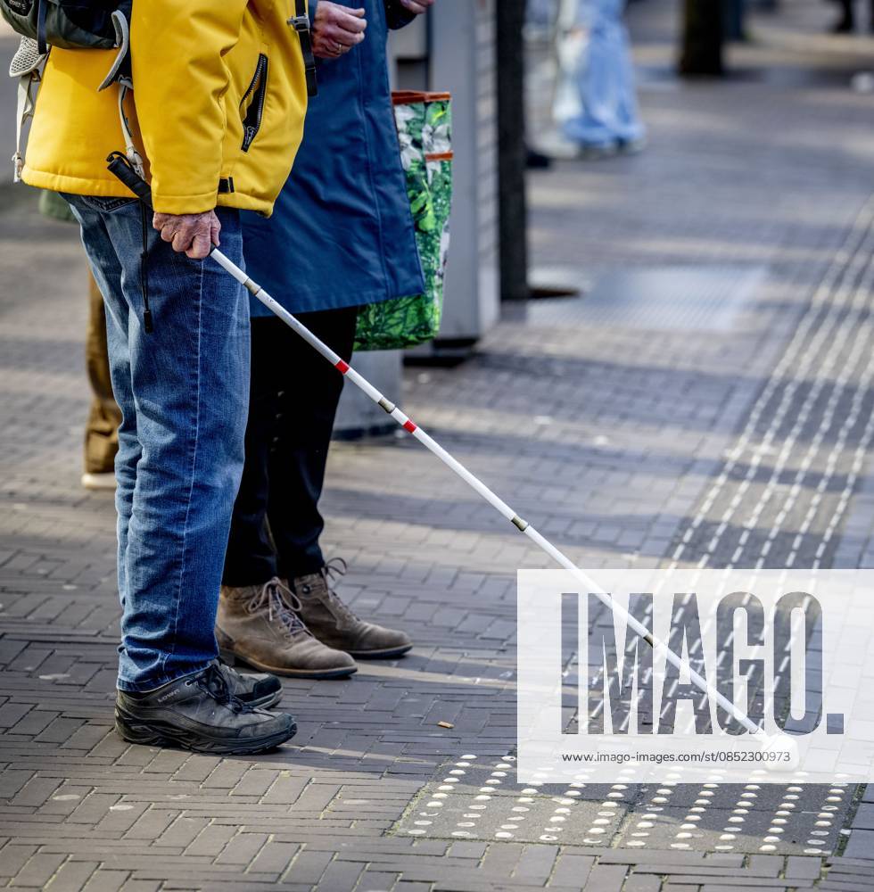 THE HAGUE - Occasionally, narrow white ribbed lines with relief tiles and tiles with small hemispheres (studs) can be seen in the streetscape. These are tactile guidance lines that serve as a very useful mobility aid for the blind and visually impaired. With these, a person with a visual impairment, with or without a white cane, receives a message: the direction of travel, a warning, or an important landmark. ROBIN UTRECHT ANP netherlands out - belgium out