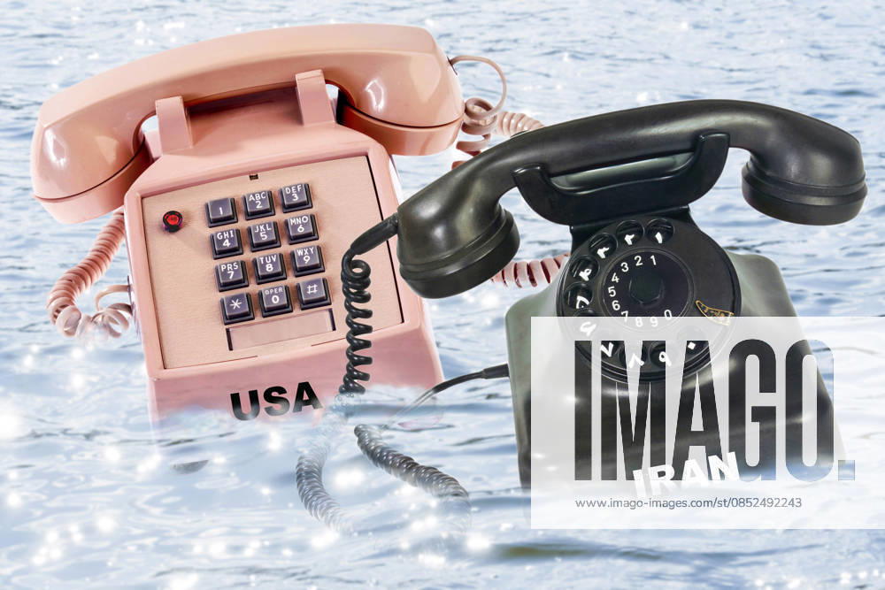 Negotiations USA Iran, symbolic photo US and Iranian telephone floating on the water, Strait of Hormuz, PHOTOMONTAGE, April 2, 2026 Germany, Munich, April 2, 2026, negotiations between USA and Iran, symbolic photo, US telephone and Iranian telephone floating on