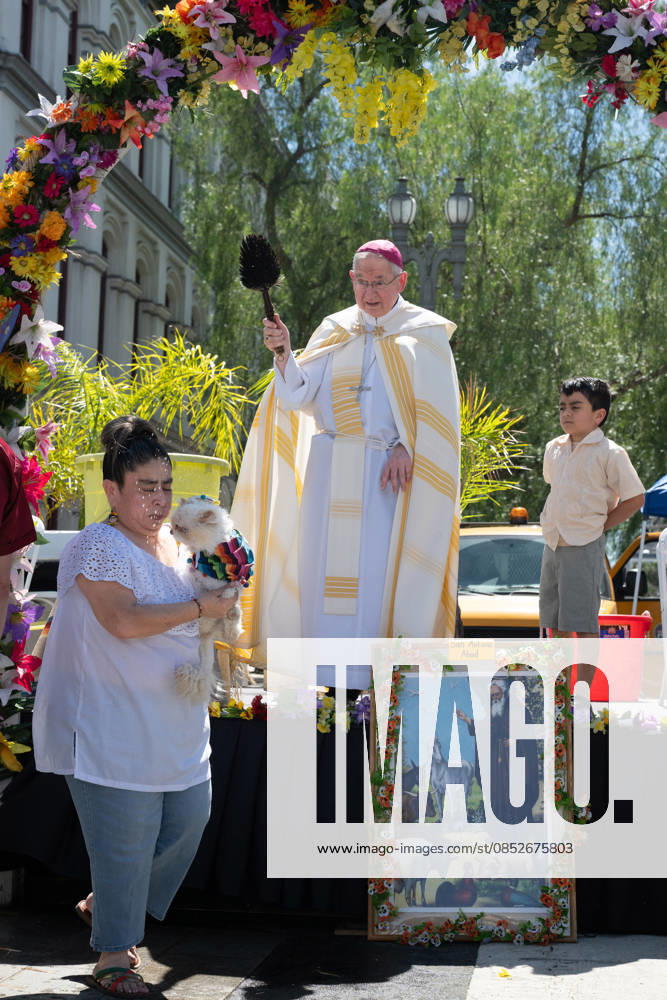 People and their pets line up in Olvera Street in Los Angeles to receive a blessing from Archbishop Jose Gomez in a Catholic tradition that celebrates St. Francis of Assisiâ€⠢s love of animals. This centuries-old tradition, usually held the Saturday before Easter, has been a part of Olvera Streetâ€⠢s history since 1930. Los Angeles USA - ZUMAh234 20260404_zsp_h234_007