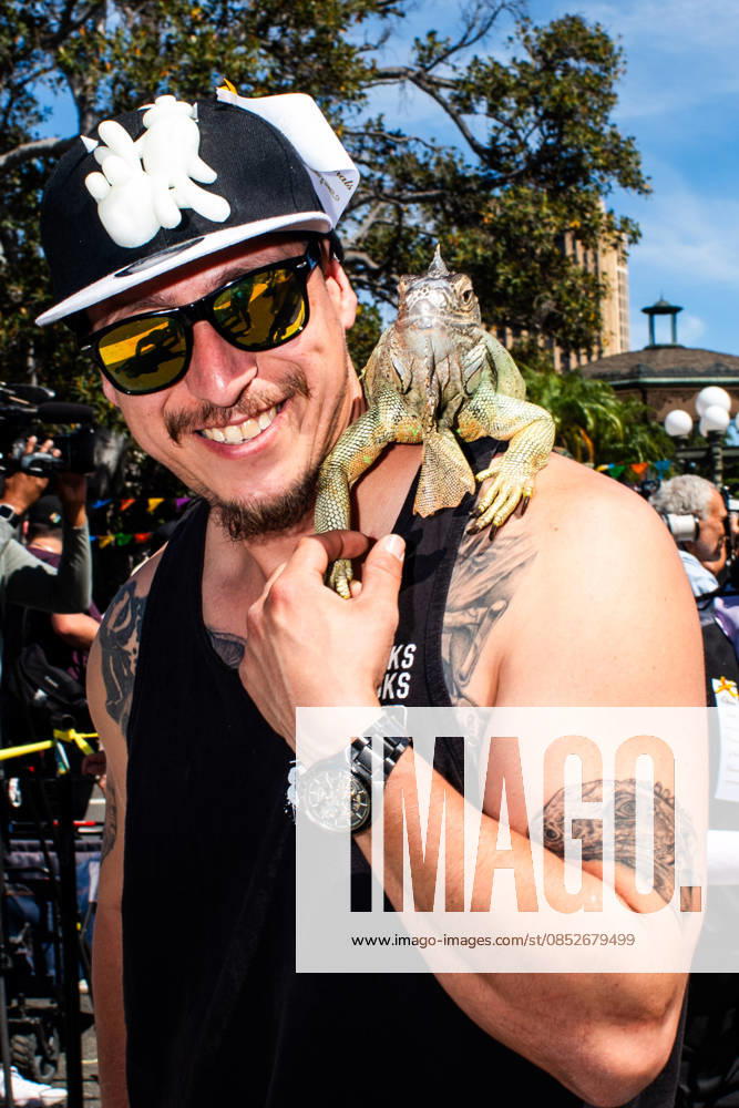 A man smiles with his iguana after being blessed during the yearly Blessing of the Animals at Olvera Street on Saturday, April 4, 2026 in Los Angeles, California. Los Angeles USA - ZUMAh206 20260404_znp_h206_003