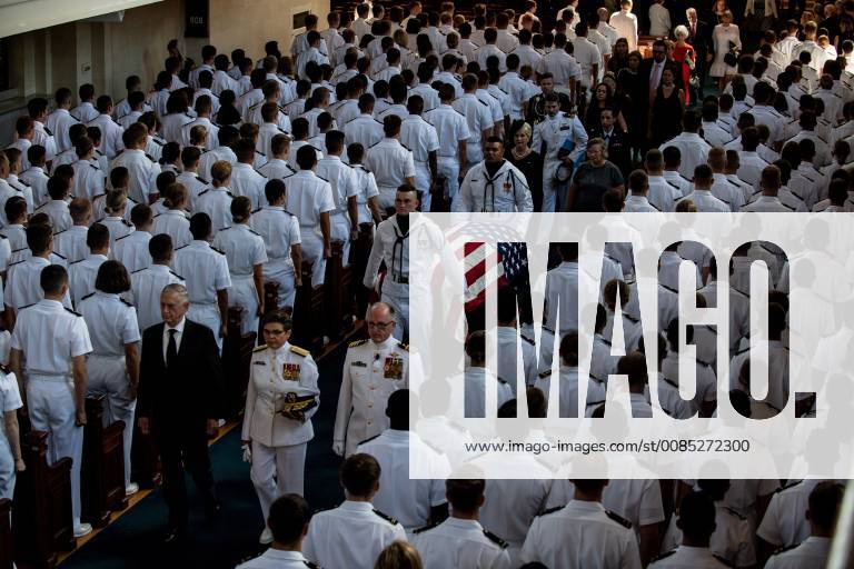 Navy Body Bearers carry the casket of the late Senator John McCain from his funeral service at the United States Naval Academy Chapel, in Annapolis, Maryland, September 2, 2018. McCain, an Arizona Republican, presidential candidate, and war hero, died August 25th at the age of 81. McCain, who graduated from the U.S. Naval Academy in 1958 was buried there today next to his friend and classmate Navy Adm. Charles Chuck Larson. U.S. Navy photo by Nathan Burke WAX20180902305 NATHANxBURKE