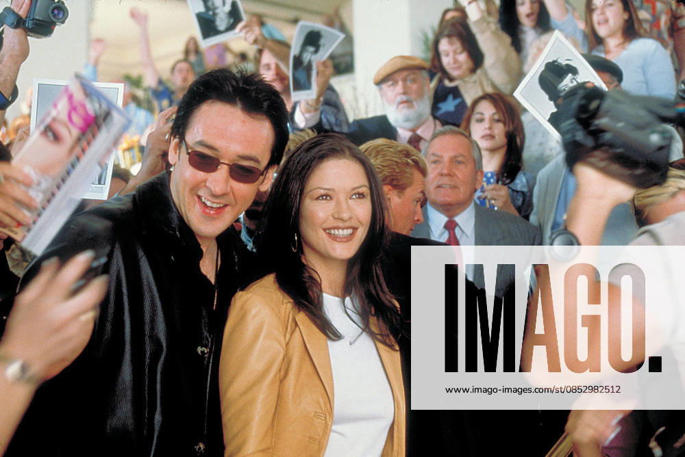 2001 - America s Sweethearts - Movie Set RELEASE DATE: July 20, 2001. MOVIE TITLE: America s Sweethearts. STUDIO: Revolution Studios. PLOT: In the midst of a nasty public breakup of married movie stars, a studio publicist scrambles to put a cap on the escalating situation as the couple s latest film has found it s only print kidnapped by the director. PICTURED: JOHN CUSACK as Eddie Thomas and CATHERINE ZETA-JONES as Gwen Harrison. Los Angeles California U.S.