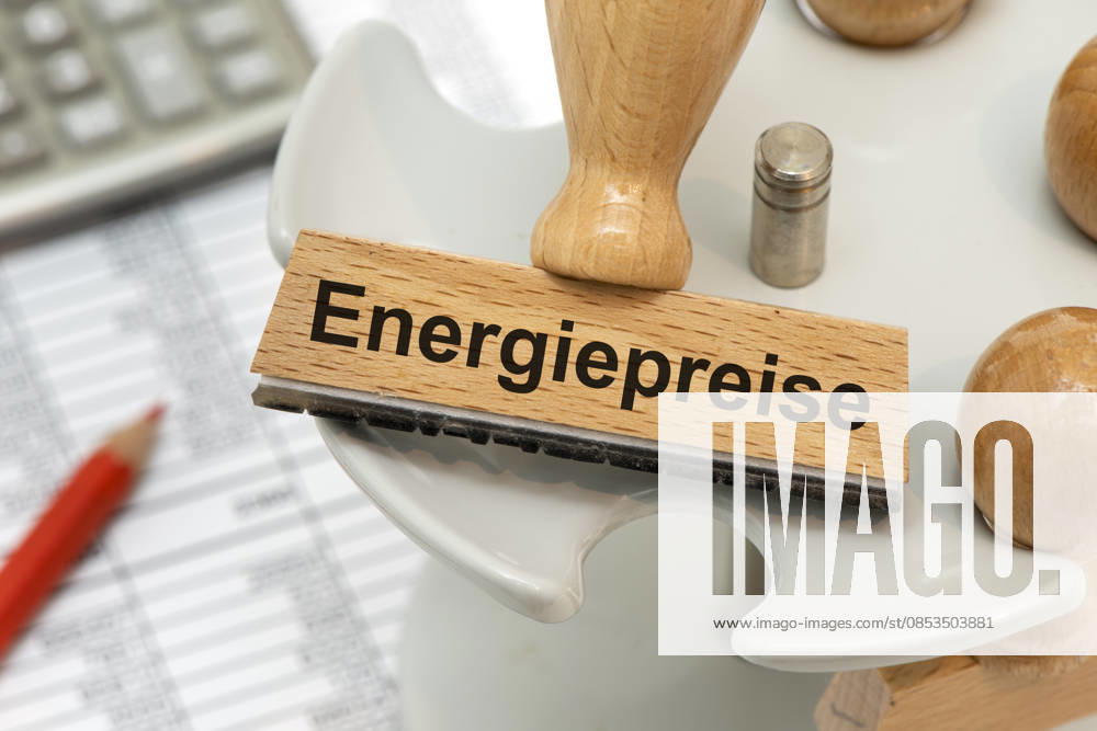 Energy costs and energy prices A wooden stamp is digitally processed with the imprint Energy prices as a symbolic image for rising energy costs in business, industry and trade