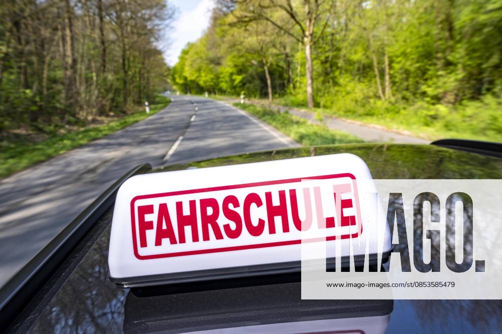 Symbolic picture driving school, driving on a country road, driving school