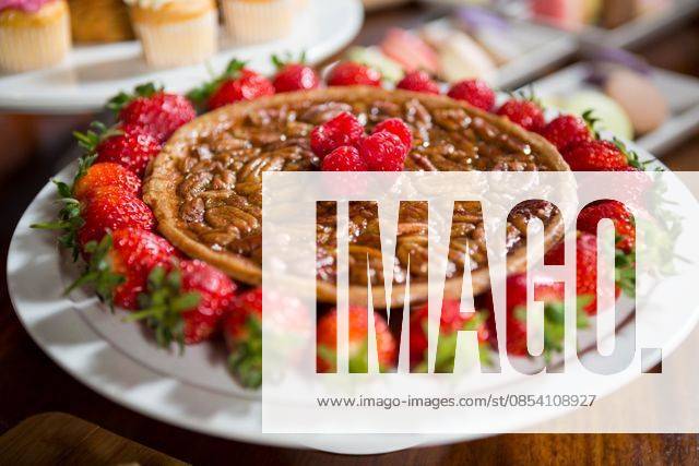Close-up of strawberry pie at display counter Close-up of strawberry pie at display counter in bakery shop, model released, , property released, Cape Town, South Africa, 04.10.2016, 932478.jpg, coffee shop, shop, market, farmer market, business, small business, bakery section, counter, pastry, cup cake, cake, delicious, dessert, cake stand, indulgence, strawberry pie, pie, strawberry, decorate, tasty, temptation, fruit, topping, raspberry