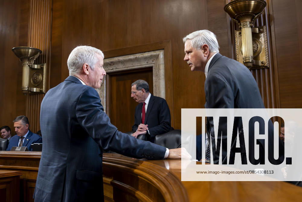 Sen. John Hoeven, R-ND, speaks with Secretary of Energy Chris Wright before a Senate Energy and Natural Resources Committee hearing on the Department of Energy s budget request for fiscal year 2027 in the Dirksen Senate Office Building near the U.S. Capitol in Washington, DC on Tuesday, April 21, 2026. Wright has warned that gas prices may not drop below $3 until next year, which the Trump Administration claims is totally wrong. WAP20260421301 BONNIExCASH