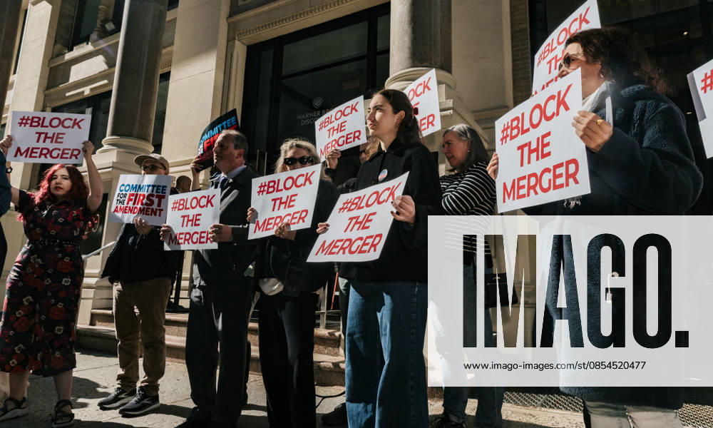 Activists holding signs in front of the Warner Bros. Discovery (WBD) headquarters in Manhattan to protest the mega merger between Paramount-Skydance and WBD. ..The merger, if approved, would put CBS, CNN, Warner Bros Pictures, Paramount Pictures, HBO, Nickelodeon, Tik Tok all under the control of Larry and David Ellison, a father and son duo who have a pro-Trump and Israel bias. ..The transaction still needs to be approved by antitrust regulators at the Department of Justice and the merger could face a separate legal challenge from California Attorney General Rob Bonta...Earlier this week more than 4,000 actors, directors, screenwriters and producers have signed an open letter opposing the merger, sa - ZUMAp287 20260423_znp_p287_002