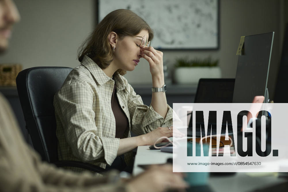 Stressed programmer experiencing burnout at office desk model released, Symbolfoto property released, KPEF01348