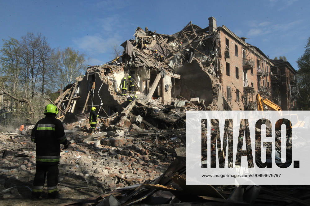Rescuers search for survivors under the rubble of a four-storey apartment block destroyed by a Russian missile strike in Dnipro, Ukraine, April 25, 2026. Russian forces launched a large-scale overnight missile and drone attack on the east-central city, damaging five multi-storey buildings, an industrial facility, a gas station, a store, and private cars. Four people have been confirmed dead, while the number of injured has risen to 27, including two children. More people may remain trapped beneath the debris as search and rescue operations are ongoing. (Photo by Mykola Miakshykov Ukrinform) Russian attack on Dnipro destroys apartment block, killing at least 4