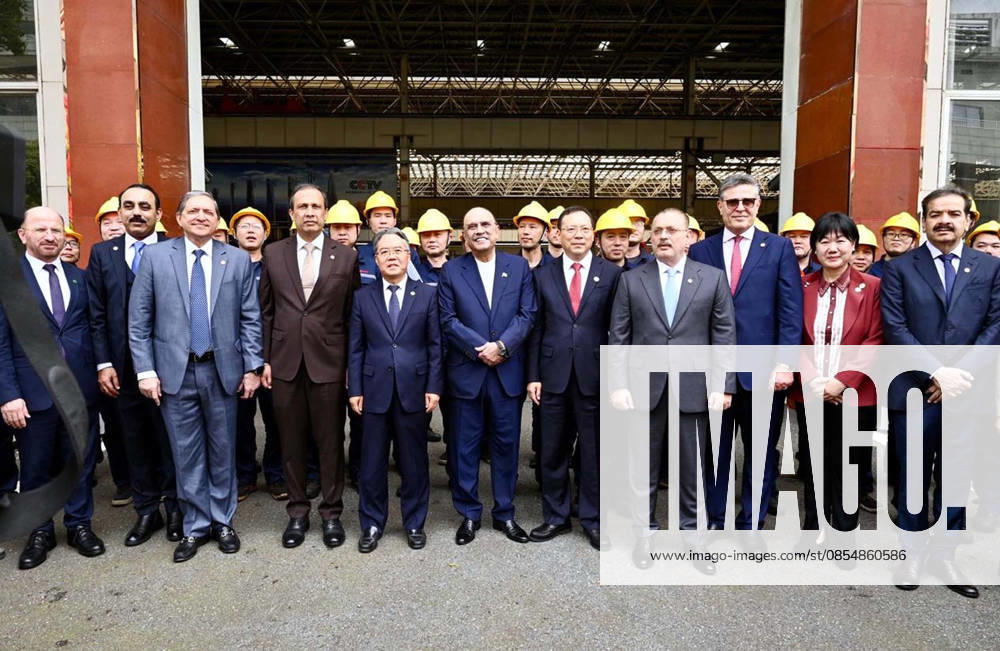 President of Pakistan, Asif Ali Zardari in a group photo along with workers during his visit to SANY Heavy Industry Co. Ltd, in Changsha on Sunday, April 26, 2026. (PPI Images).