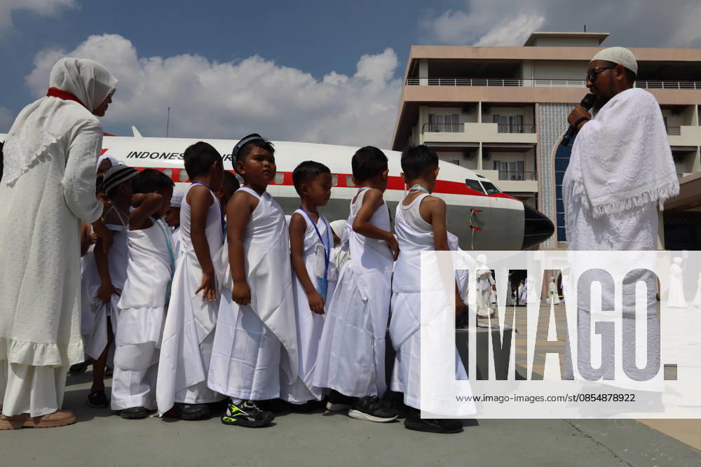 Kindergarten children listen to the direction of his teacher, before carrying out a series of during Hajj manasik education at the Aceh Hajj Embarkation Dormitory in Banda Aceh City, Aceh province, Indonesia on Monday, April 27, 2026. The activity which was attended by thousands of kindergarten students, aims to introduce the procedures for Hajj to children from an early age. Banda Aceh Indonesia - ZUMAs340 20260427_zip_s340_024