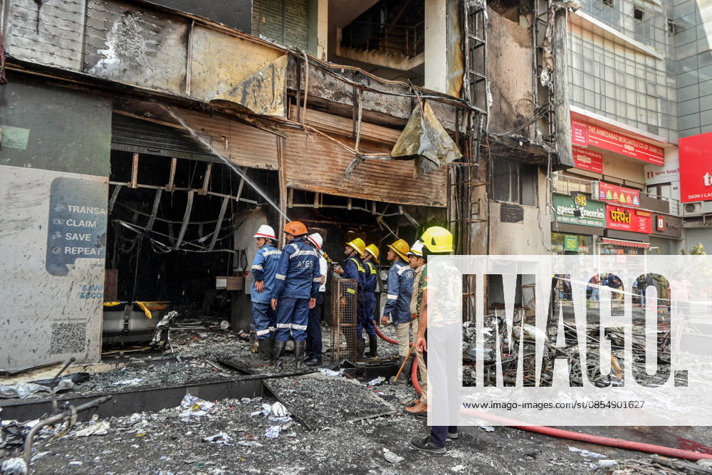 Firefighting operations underway after a fire breaks out at a three-storey building Ahmedabad, Apr 27 (ANI): Firefighting operations underway after a fire breaks out at a three-storey building, at Shyamal crossroad, in Ahmedabad on Monday. Ahmedabad Gujarat India