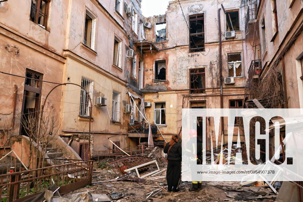 A rescuer and a woman stand in the courtyard of an apartment block damaged by a Russian drone attack in Odesa, Ukraine, April 27, 2026. The Russian army once again struck residential areas and civilian infrastructure in the southern city, with the heaviest damage recorded in the Prymorskyi district. Ten people, including two children, required medical assistance. (Photo by Nina Liashonok Ukrinform) Russian army attacks residential areas, civil infrastructure in Odesa
