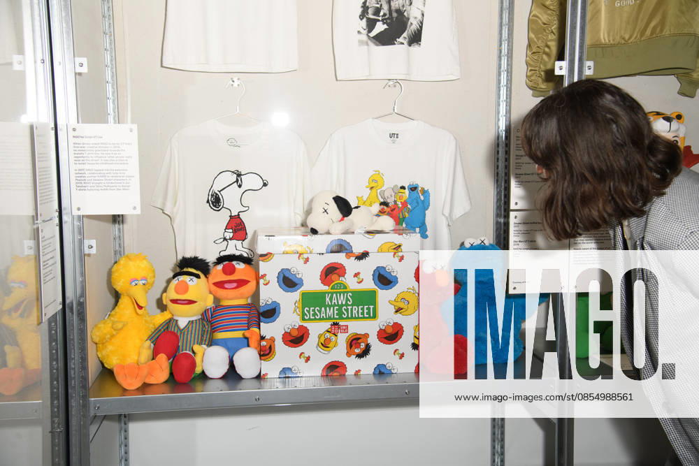 NIGO: From Japan with Love Press Preview at Design Museum, London, UK - A staff member poses with Sesame Street, Snoopy collection as part of Nigo for Uniqlo UT Line x KAWS at a photocall for The Design Museum s NIGO: From Japan with Love Exhibition at The Design Museum in London, England, UK on Tuesday 28 April 2026 which runs from 1st May 2026 - 4th October 2026., Credit:Justin Ng Avalon UK, England, London, Design Museum
