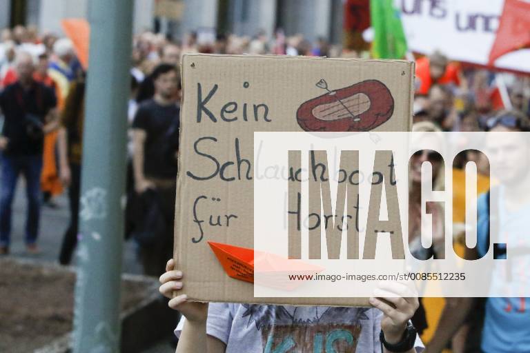 Germany: Anti-Seehofer rally in Frankfurt A protester holds up a sign that reads No inflatable boat for Horst . Around 6.300 protesters marched through Frankfurt, in support of the Seebrucke (Sea Lift) movement for the rescuing of refugees from the Mediterranean Sea. They also protested against the restrictive refugee policies of German Federal Interior Minister Horst Seehofer, who was due to speak at a congress in Frankfurt the following day, but whose appearance was cancelled. Frankfurt Hesse Germany MichaelxDebets