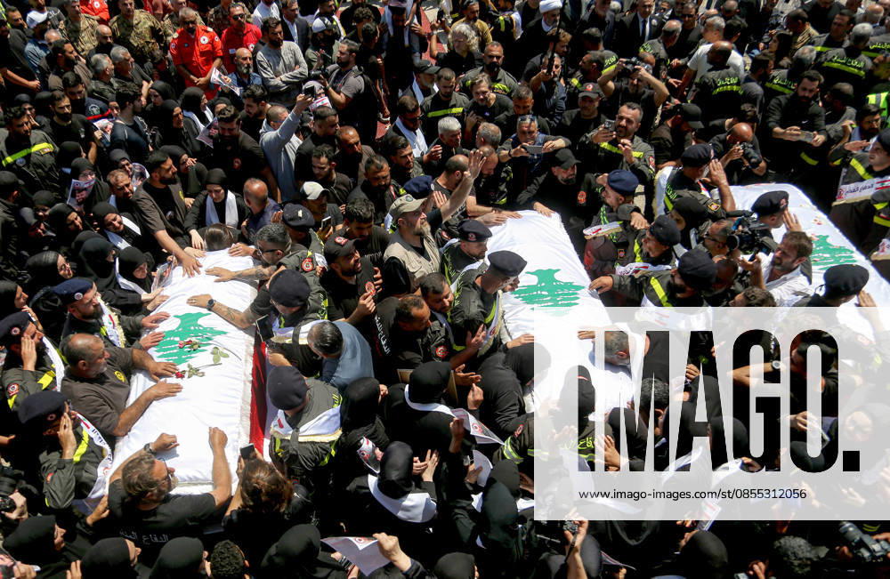 Tyre,, Lebanon: Mourners gather around the coffins of three Lebanese Civil Defense members, who were killed in an Israeli air strike in the southern Lebanese village of Majdal Zoun, during their funeral procession in the port city of Tyre. The Israeli military has intensified its campaign in southern Lebanon, issuing new evacuation orders for residents in numerous villages, warning them not to return to the area. Tyre Lebanon - ZUMAn313 20260430_zip_n313_001