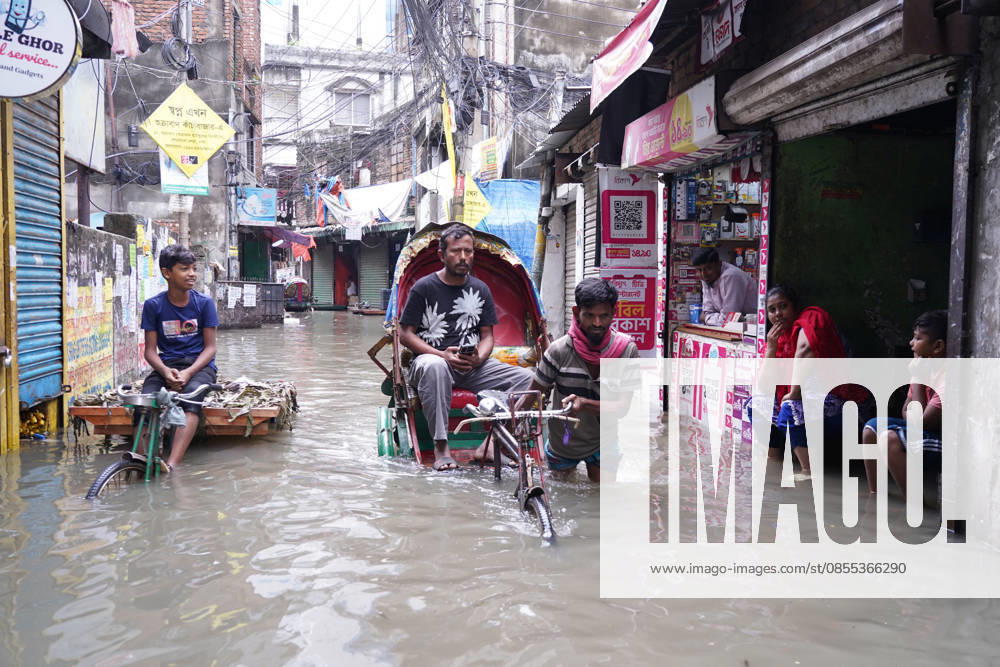 DHAKA, BANGLADESH Ã¢â‚¬ May 1, 2026: After several hours of continuous rainfall, many small and major roads across the capital Dhaka were submerged, with water levels ranging from knee-deep to waist-deep in some areas. People forced to leave their homes for work faced severe difficulties, disrupting normal city life. Stray dogs and other animals were also left vulnerable in the flooded conditions. In many cases, clogged manholes filled with plastic waste and debris obstructed drainage systems, leading to widespread waterlogging. Dhaka Bangladesh - ZUMAk185 20260501_zip_k185_006