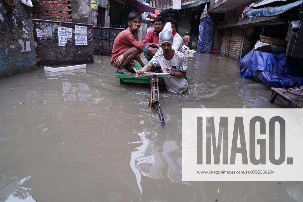 DHAKA, BANGLADESH †May 1, 2026: After several hours of continuous rainfall, many small and major roads across the capital Dhaka were submerged, with water levels ranging from knee-deep to waist-deep in some areas. People forced to leave their homes for work faced severe difficulties, disrupting normal city life. Stray dogs and other animals were also left vulnerable in the flooded conditions. In many cases, clogged manholes filled with plastic waste and debris obstructed drainage systems, leading to widespread waterlogging. Dhaka Bangladesh - ZUMAk185 20260501_zip_k185_007