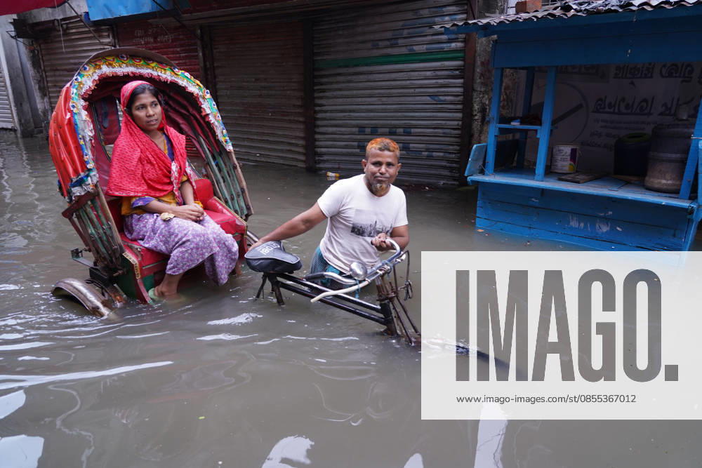 DHAKA, BANGLADESH Ã¢â‚¬ May 1, 2026: After several hours of continuous rainfall, many small and major roads across the capital Dhaka were submerged, with water levels ranging from knee-deep to waist-deep in some areas. People forced to leave their homes for work faced severe difficulties, disrupting normal city life. Stray dogs and other animals were also left vulnerable in the flooded conditions. In many cases, clogged manholes filled with plastic waste and debris obstructed drainage systems, leading to widespread waterlogging. Dhaka Bangladesh - ZUMAk185 20260501_zip_k185_032
