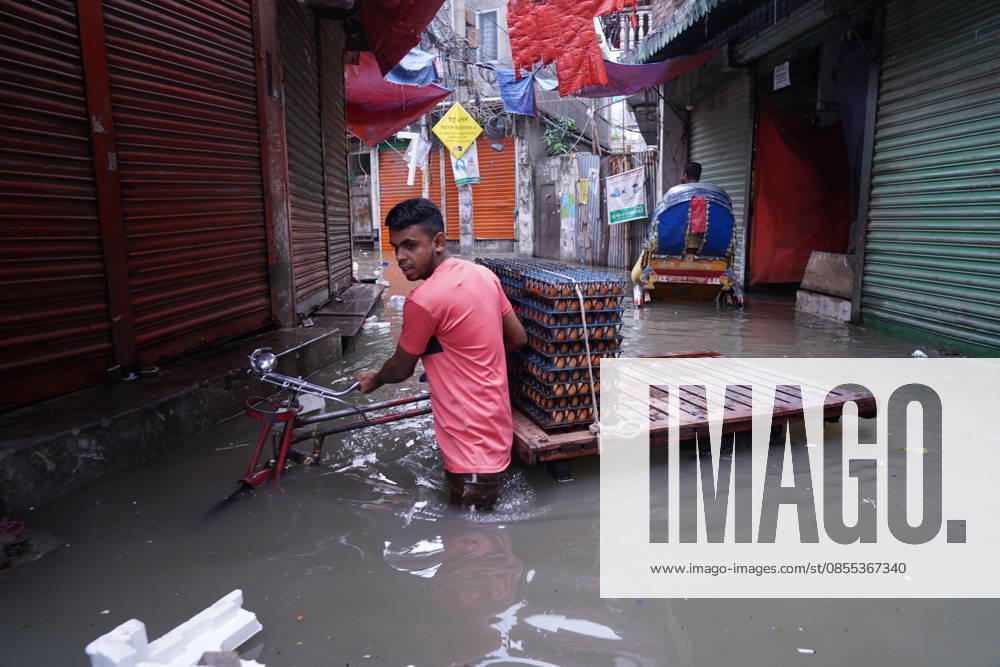 DHAKA, BANGLADESH Ã¢â‚¬ May 1, 2026: After several hours of continuous rainfall, many small and major roads across the capital Dhaka were submerged, with water levels ranging from knee-deep to waist-deep in some areas. People forced to leave their homes for work faced severe difficulties, disrupting normal city life. Stray dogs and other animals were also left vulnerable in the flooded conditions. In many cases, clogged manholes filled with plastic waste and debris obstructed drainage systems, leading to widespread waterlogging. Dhaka Bangladesh - ZUMAk185 20260501_zip_k185_017