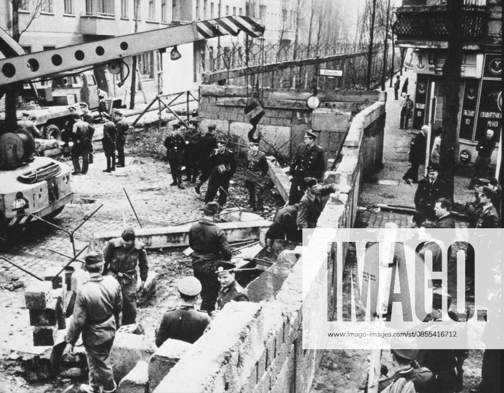 Construction of the Berlin Wall dividing East from West Germany in 1961. Construction of the Berlin Wall. dividing East from West Germany. 1961 Editorial use only. All other uses to be cleared with the copyright owner (World History Archive), in advance., WHA_020_0117.jpg, Berlin Wall; construction; East Germany; West Germany; 1961; Cold War; division; barrier; separation; border; communism; socialism; Soviet Union; United States; conflict; history; politics; Europe; Berlin; Germany; iron curtain; containment; containment policy; Soviet bloc; Western bloc; divided city; divided country; Berlin crisis; Berlin blockade; Berlin airlift; Checkpoint Charlie.