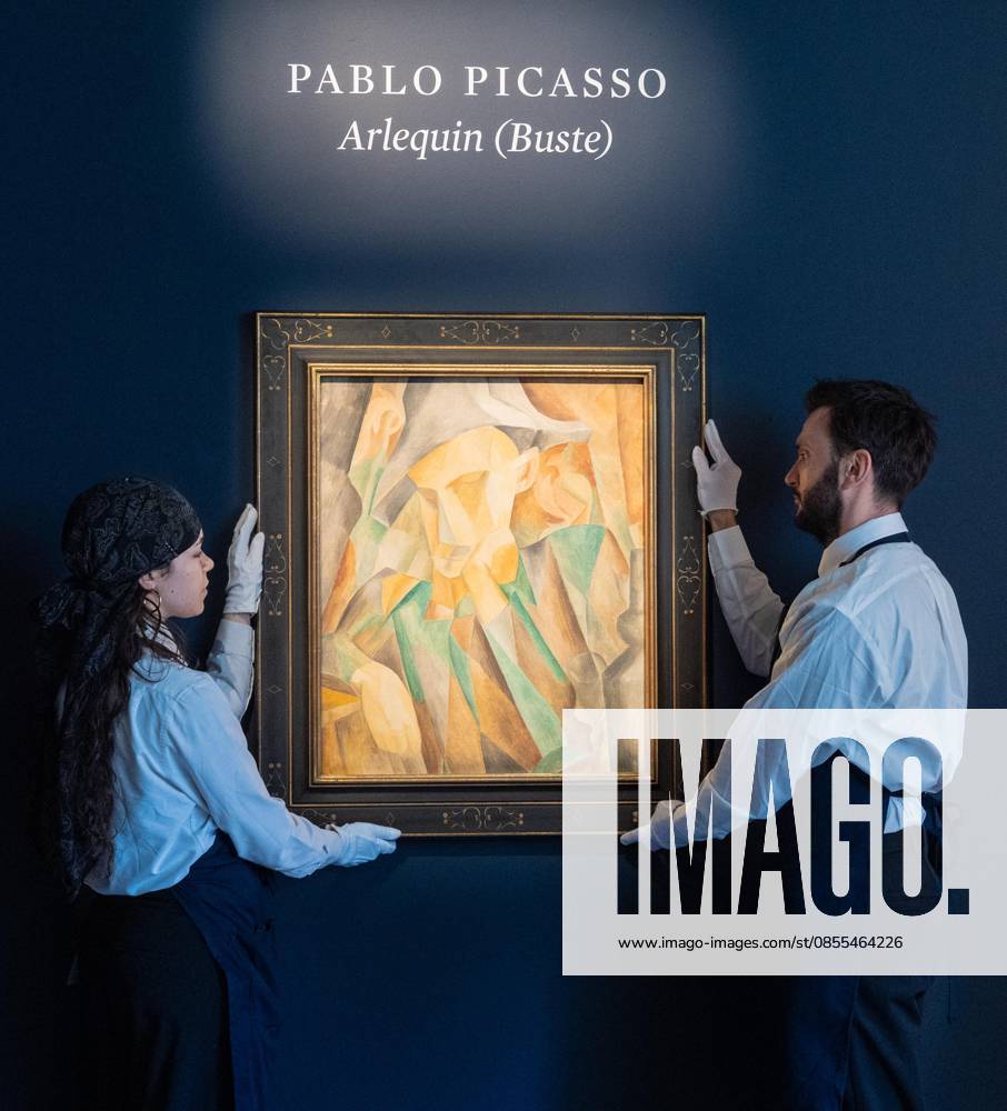 Auction assistants pose with Pablo Picasso Arlequin during May Marquee Modern & Contemporary Auctions press preview at Sotheby s The Breuer in New York, NY on May 1, 2026. Bronx USA - ZUMAr339 20260501_znp_r339_037