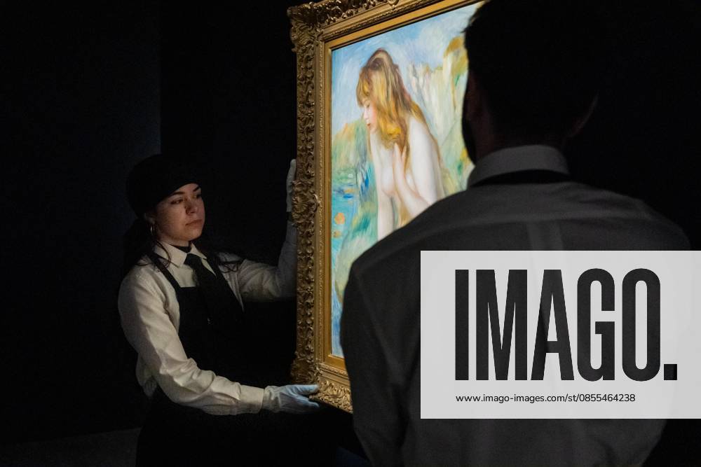 Auction assistants pose with Pierre-Auguste Renoir Baigneuse assise sur un rocher during May Marquee Modern & Contemporary Auctions press preview at Sotheby s The Breuer in New York, NY on May 1, 2026. Bronx USA - ZUMAr339 20260501_znp_r339_030