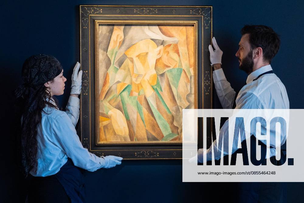 Auction assistants pose with Pablo Picasso Arlequin during May Marquee Modern & Contemporary Auctions press preview at Sotheby s The Breuer in New York, NY on May 1, 2026. Bronx USA - ZUMAr339 20260501_znp_r339_038