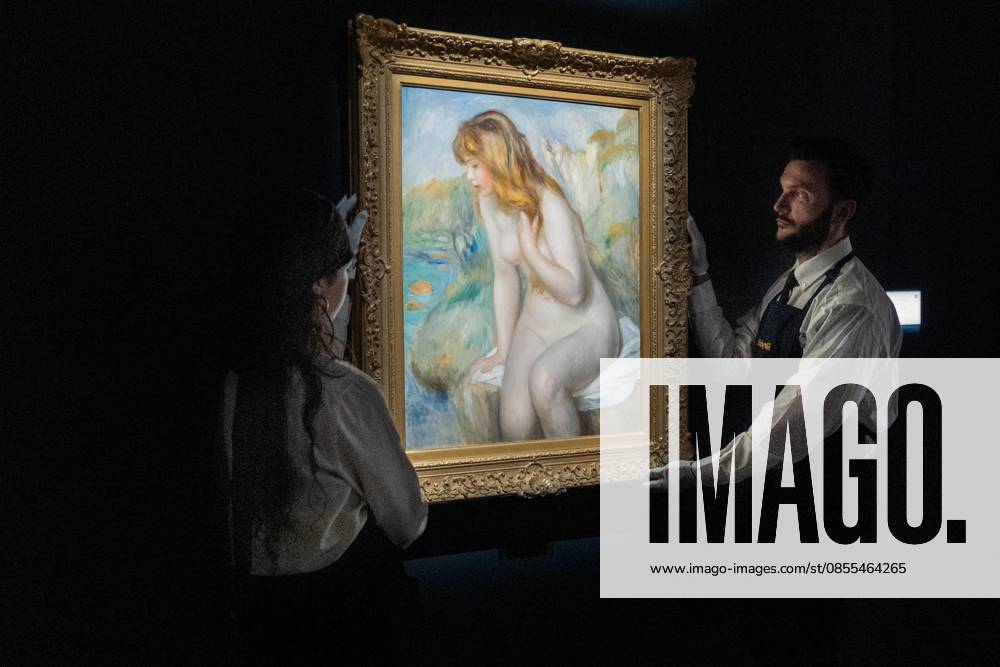 Auction assistants pose with Pierre-Auguste Renoir Baigneuse assise sur un rocher during May Marquee Modern & Contemporary Auctions press preview at Sotheby s The Breuer in New York, NY on May 1, 2026. Bronx USA - ZUMAr339 20260501_znp_r339_029