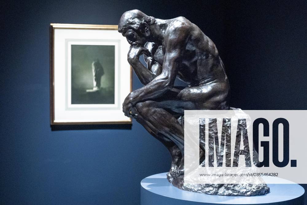 Bronze sculpture Penseur, Taille De La Porte Dit Moyen Modele by Auguste Rodin with photograph Balzac by Edward Steichen on the background on view during May Marquee Modern & Contemporary Auctions press preview at Sotheby s The Breuer in New York, NY on May 1, 2026. Bronx USA - ZUMAr339 20260501_znp_r339_025